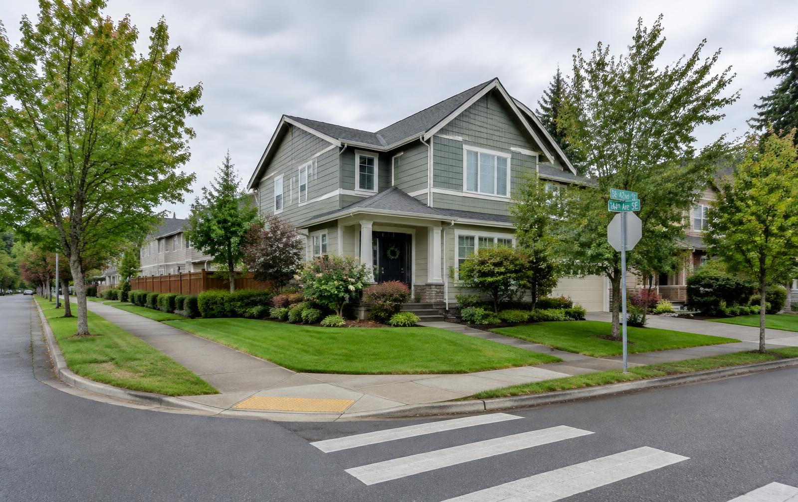 Two-story family home on a corner lot with sidewalks on two sides in an Eastside suburb
