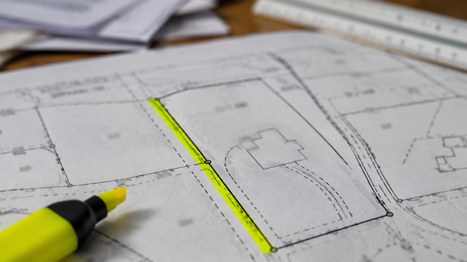 Plat survey drawing with a highlighted strip along a lot line