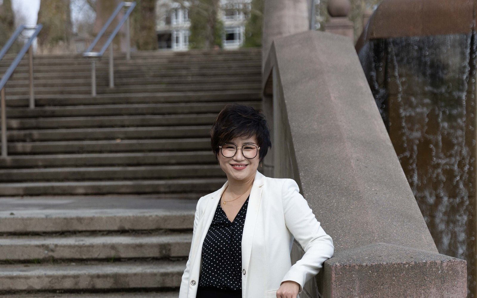 Maggie Sun, Managing Broker, helping families check school assignment in Bellevue